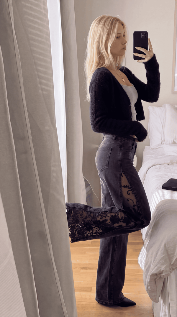 Black wide leg lace jeans styled with a black cardigan